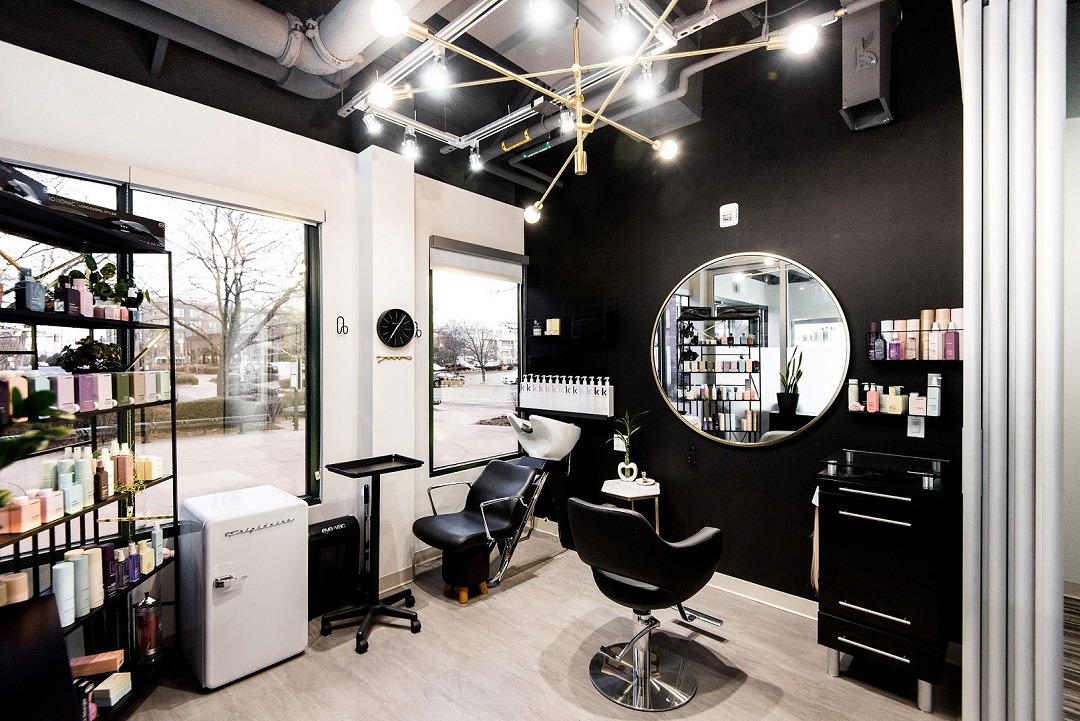 Interior view of the Auréa salon — warm lighting, natural materials, and a calm ambience
